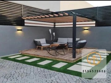 تصميم وتركيب البرجولات والعشب الصناعي في الباحة | حلول حدائق عصرية